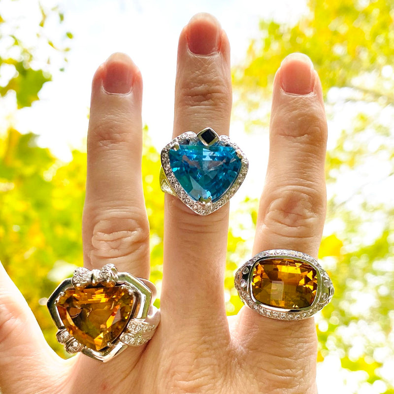 Topaz rings in blue and yellow when worn