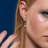 Image of model wearing 9ct White Gold Diamond Pavé Hoop Earring with Star Engraved Attachable Charm - Juraster