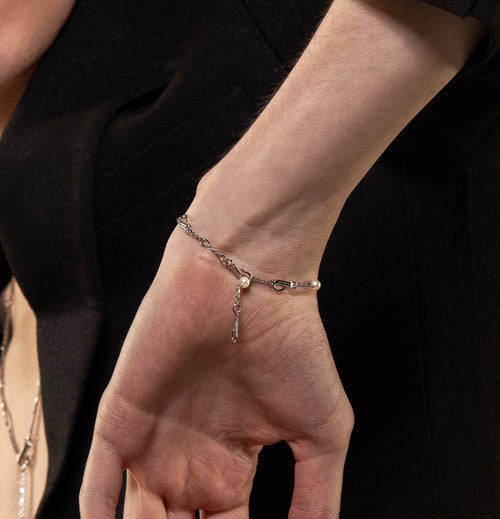 Image of model wearing Sterling Silver Akoya Pearl Adjustable Transforming Bracelet - Juraster
