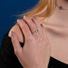 A model wearing Juraster’s 9ct White Gold Diamond Ring, Compass, crafted from Fairmined 9ct white gold and conflict-free diamonds.