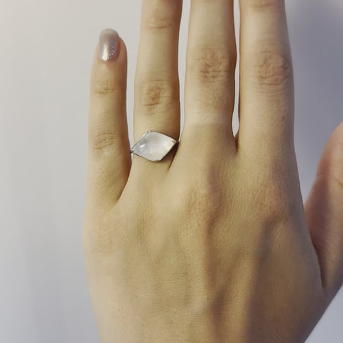 A video of a model wearing Juraster’s 9ct White Gold Rainbow Moonstone Ring, Talisman, crafted from Fairmined 9ct white gold and a hand-cut moonstone.